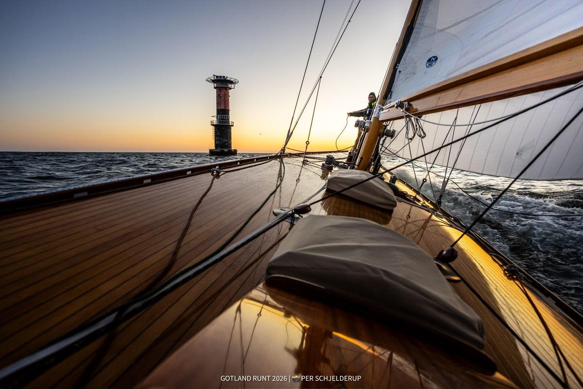 Sailing past a lighthouse at sunset, Gotland Runt