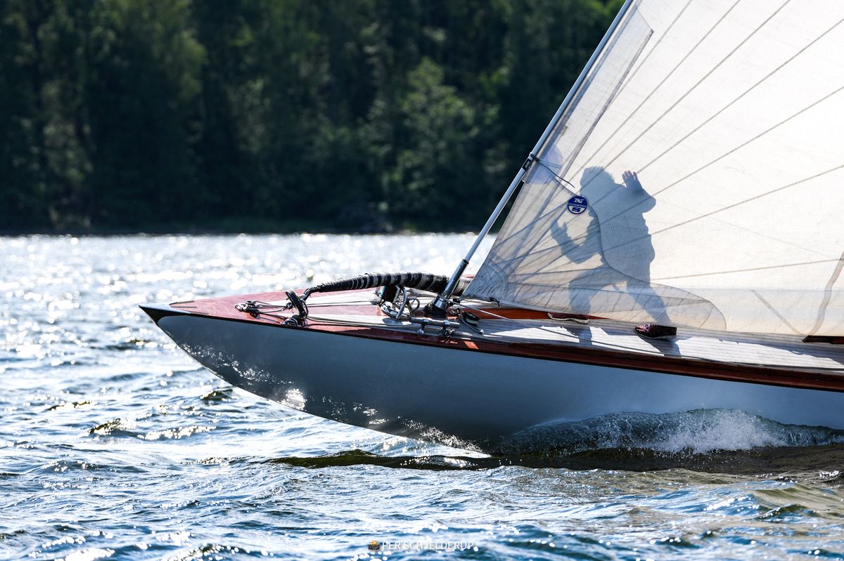 Classic sailboat bow cutting through water